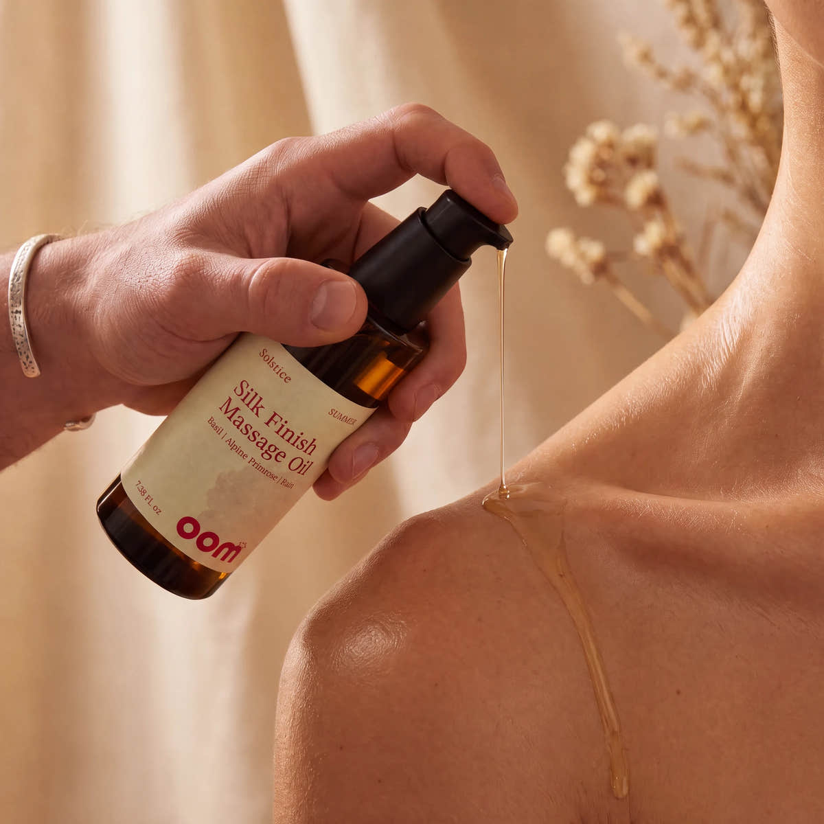 Solstice massage oil being poured